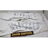 A PAIR OF RACING JOCKEY'S JODHPURS with "John Smiths" decals, autograph signed by amongst other