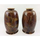 A PAIR OF ROYAL DOULTON STONEWARE VASES, decorated with Autumnal foliage in shades of brown and