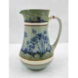 MACINTYRE FOR WILLIAM MOORCROFT A FLORIAN WARE "BLUE POPPY" PATTERNED JUG, having tube lined and