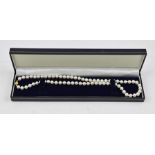 A SINGLE STRAND OF CULTURED PEARLS with 9ct gold clasp, in vendor's case