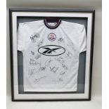 A BOLTON WANDERERS TEAM SIGNED FOOTBALL SHIRT, includes Peter Beardsley, in glazed frame, overall