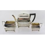 A LATE VICTORIAN SILVER THREE-PIECE BACHELOR TEA SET, of rectangular form with fluted decoration, on