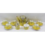 A PARAGON BONE CHINA COFFEE SET FOR SIX yellow ground with applied silver decoration comprising;