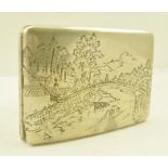 AN EARLY 20TH CENTURY JAPANESE WHITE METAL CIGARETTE CASE, having chased landscape decoration with