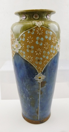 A ROYAL DOULTON STONEWARE VASE having blue mottled body with green mottled shoulders, tube lined and