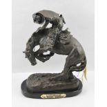 AFTER FREDERICK REMINGTON A bronze sculpture 'Rattlesnake', part of a Legends in bronze series, on