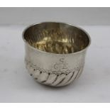 AN EARLY SILVER DRINKING BOWL OR TUMBLER CUP, having flared rim and fluted base, engraved "S"