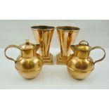 A PAIR OF GUERNSEY COPPER CREAM CANS and a pair of ART DECO COPPER VASES of tapering cone form, on