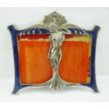 AN ART NOUVEAU STYLE DOUBLE PHOTOGRAPH FRAME, cast metal and blue enamel, figurative centre, overall