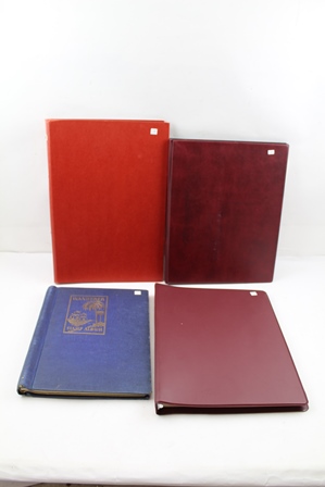 FOUR VARIOUS STAMP ALBUMS; maroon album with GB mint, mainly 1980 red album with some earlier GB