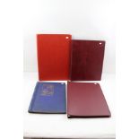 FOUR VARIOUS STAMP ALBUMS; maroon album with GB mint, mainly 1980 red album with some earlier GB
