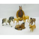 A ROYAL WORCESTER BONE CHINA CORGI no.3243, together with a quantity of horse china ornaments,