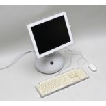 AN APPLE I MAC POWER PC G4 together with keyboard and mouse