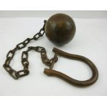 AN IRON ANKLE SHACKLE with ball and chain