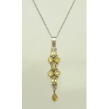 A YELLOW STONE SET SILVER PENDANT on silver chain