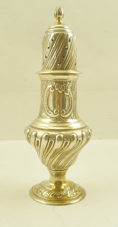 A LATE VICTORIAN SILVER SUGAR CASTER of Georgian design, wrythen embossed with blind cartouche,