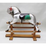 A "LINES BROTHERS LTD" ROCKING HORSE, dapple grey painted with restored mane and tail and leather