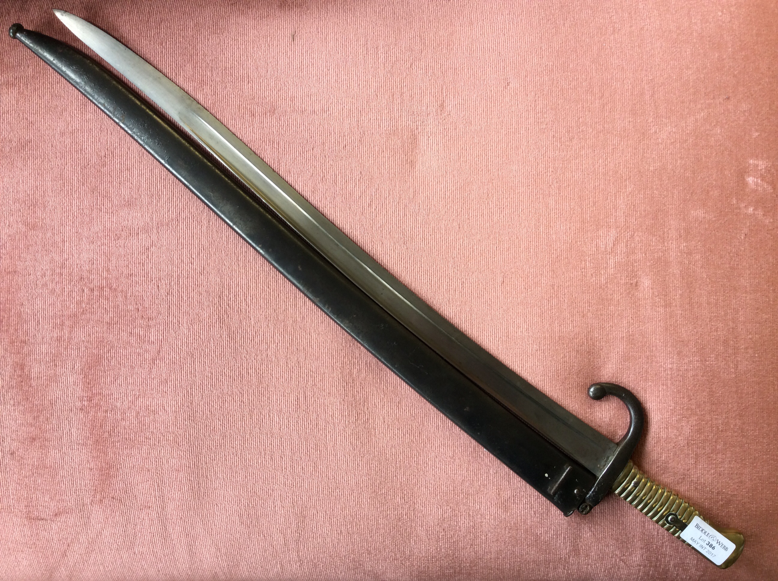 A 19th Century French chassepot bayonet, marked to top of blade St Etienne 1870, with scabbard.