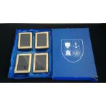 A set of four silver photograph frames, each of plain rectangular design, each stamped at a