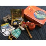 Lot to include a View-Master with reels, an oil can, car badges, puppet and an Escalado race game.