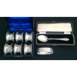 A boxed set of six silver napkin rings, each hallmarked Birmingham 1919, together with a boxed