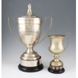 An EPNS twin-handled lidded trophy engraved ‘The Charles Edwards Trophy’, raised on a black