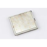 A silver and enamel cigarette case, featuring white guilloche enamel overlaid with gold enamel Fleur