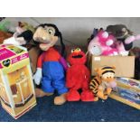 Collection of soft toy animals including Elmo, tigger, Sunday's shower and bath, etc.