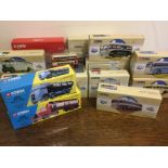 A collection of assorted boxed Corgi buses, trams and commercial vehicles in assorted liveries,