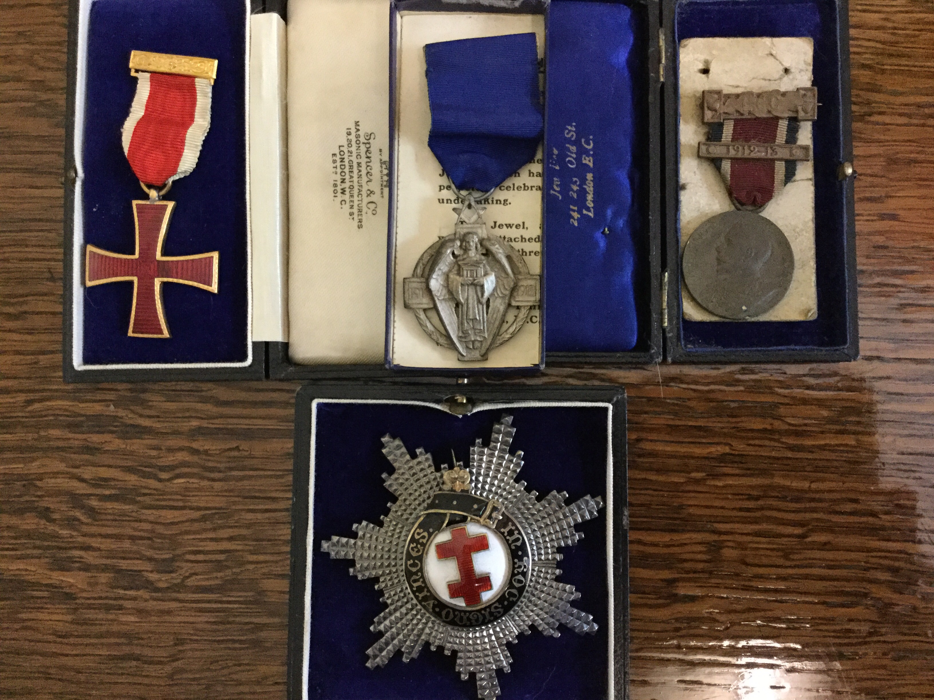 A group of four medals to include; Masonic silver and enamelled Cross of Lorraine breast badge