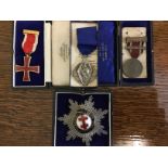 A group of four medals to include; Masonic silver and enamelled Cross of Lorraine breast badge