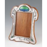 An early 20th Century Art Nouveau silver photograph frame with later applied blue and green