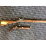 A reproduction flint lock rifle with mahogany stock, together with a reproduction flint lock