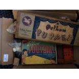 A selection of assorted games to include; two Pelham puppet poodles, wooden jigsaws, blow football