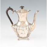 An Elkington & Co early 20th Century silver water / coffee pot, featuring repousse acanthus repeat