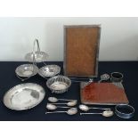 A collection of early to mid 20th Century hallmarked silver items to include a tiered bowl set, a