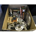 A box containing model cars, figures, key rings, barrel, glass items, plated ware and a wall plate.