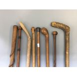 8 gentleman's walking canes and sticks to include one folk art with snake wrapped around cane, one