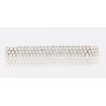 An 18ct white gold diamond bracelet, comprising of three rows of 62 round brilliant cut diamonds,