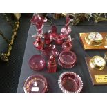 A selection of red cut glass to include vases, bowls, glass decanters etc.