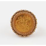 A 1985 Fine Gold 1/10oz Angel Isle of Man coin, mounted in a hallmarked 9ct yellow gold ring