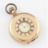 A Waltham USA gold plated crown wind half hunter pocket watch, the white enamel dial having hourly