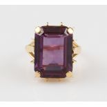 An 18ct yellow gold synthetic colour change sapphire dress ring, stone measures approx. 18x13mm,