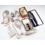 A collection of hallmarked silverware to include a silver rimmed glass trinket bowl, two