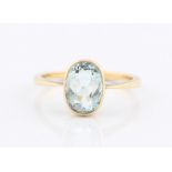 An aquamarine ring, set with an oval cut aquamarine, measuring approx. 9x6mm, indistinctly