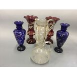 Two pairs of coloured glass vases with white hand painted decoration, a grape and vibe engraved