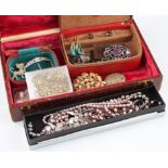 A collection of various costume jewellery to include a buckle, earrings, pearls, necklets, a