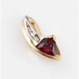 A garnet and diamond pendant, set with a triangular cut rhodolite garnet, with three graduated round