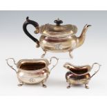 A matched early 20th Century bachelors tea set, comprising a tea pot, sugar bowl and milk jug,