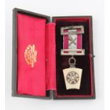 A Masonic medal, housed in a Spencer & Co. box.